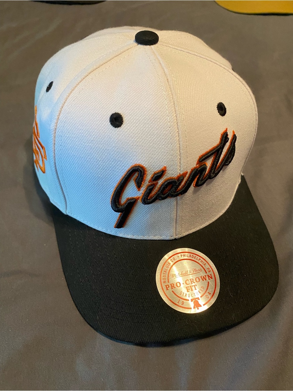 Mitchell & Ness White Snapback Hat with Orange Undervisor